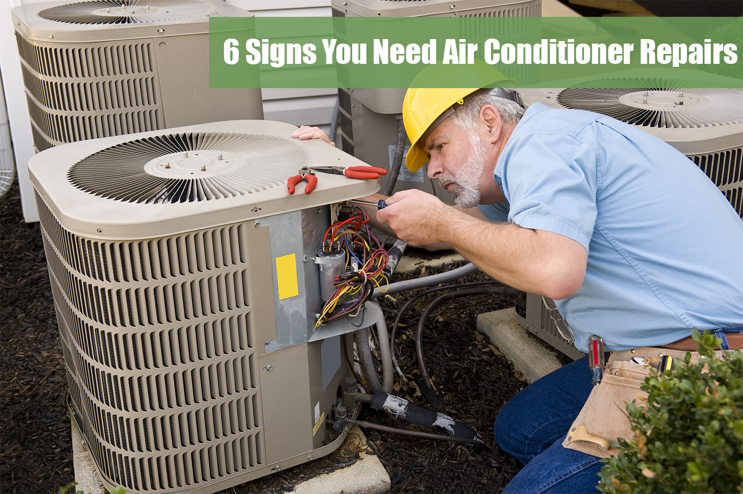 Ac technician in a blue shirt and yellow hard hat performing air conditioner repairs on an outdoor unit.
