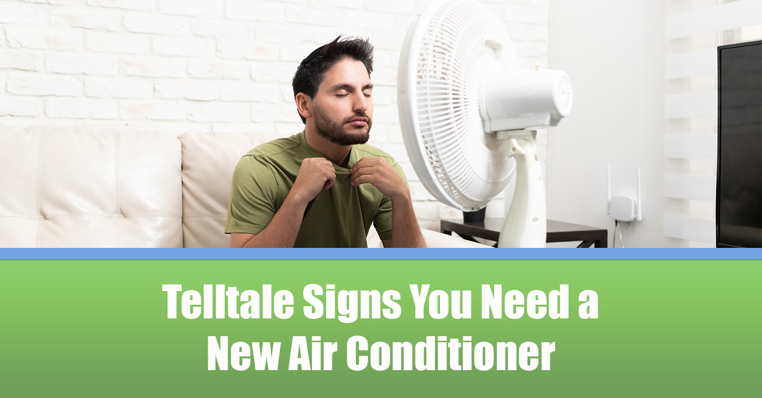 A man in need of a new air conditioner sitting in front of a fan trying to get cool.